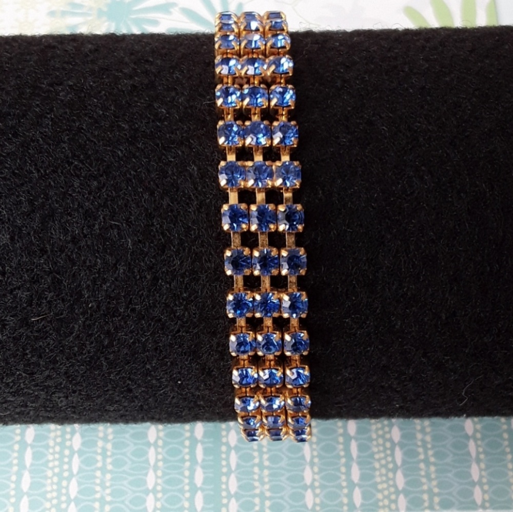 Gold tone bracelet with blue rhinestones